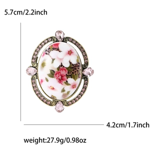 Baroque floral brooch with pink enamel and crystals in antique bronze oval frame
