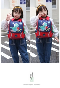 Detail of waterproof kids backpack featuring space dinosaur pattern and red-blue design