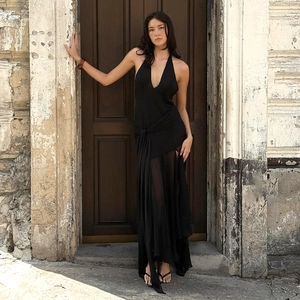 Detail of elegant black halter deep V-neck chiffon dress with irregular layered tulle skirt