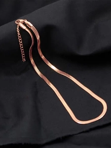 Detailed view of rose gold snake bone chain with lobster clasp and extension link