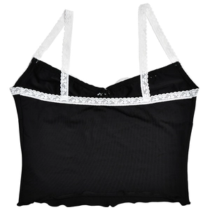 Detail of black camisole crop top featuring delicate white lace trim and straps on white backdrop
