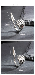 Detailed view of silver Hamsa hand hoop earring with red gemstone and evil eye engraving