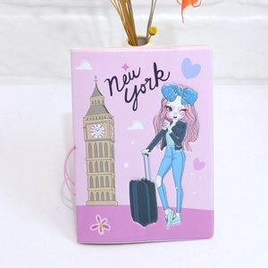 Detailed view of pink cartoon passport cover with travel illustration and elastic strap