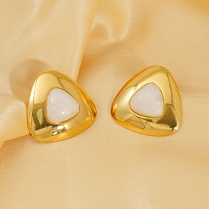 18K gold plated triangle stud earrings with white stone inlay on luxury gold silk background