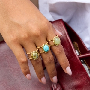 Detailed shot of three 18K gold-plated stainless steel rings featuring blue turquoise stones
