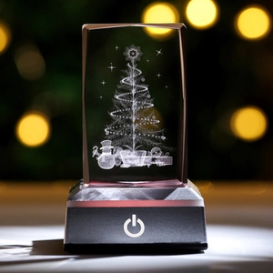 Macro detail of 3D laser engraved crystal Christmas tree and snowman with LED base