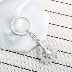 Rotating crystal snowflake keychain in silver alloy with spring clip for backpacks