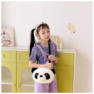 Close-up of a large plush panda shoulder bag worn by a girl in a cozy indoor setting