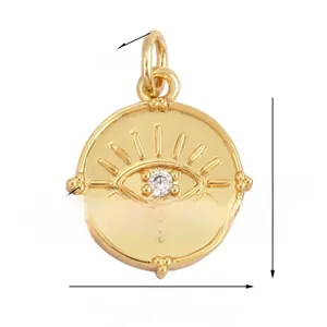 Detail of gold evil eye pendant showing central zircon and circular dimensions