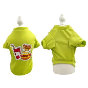 Detail view of bright green dog t-shirt with fast food patches on soft knit fabric