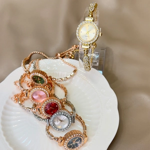 Close-up of luxury women quartz watches with rhinestones in gold, silver and rose gold