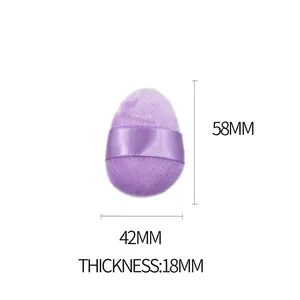 Detailed view of the purple velvet makeup puff with dimensions 58mm by 42mm by 18mm
