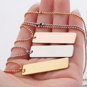 Three bead chain necklaces with rectangular bar pendants in rose gold, silver, and gold