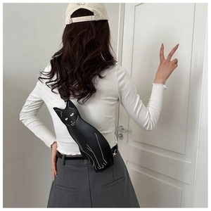Detail of cute black cat shaped crossbody bag made of premium synthetic leather