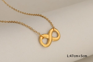 Detailed view of infinity symbol necklace in gold finish with 47cm length parameter