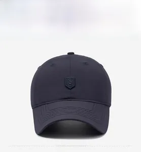 Detailed front view of navy blue baseball cap with shield logo and reinforced visor seams
