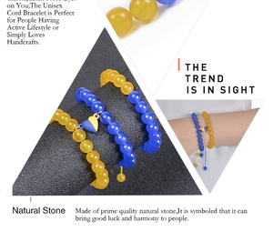 Detailed view of handmade yellow and blue natural stone bracelets with heart charm