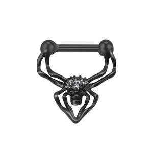 Close-up of black spider nipple piercing with sparkling rhinestones on white background