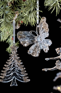Detail of glittery acrylic Christmas ornaments with butterfly and ballet dancer shapes