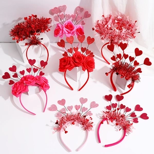 Multiple Valentine heart headbands with red pink glitter and rose floral decorations