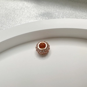 S925 sterling silver rose gold round bead with zircon pave on a white tray