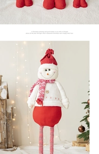 Close-up of a festive plush snowman with telescopic legs and Nordic style scarf decoration