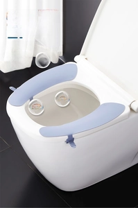 Close-up of blue silicone toilet seat cover with Ag+ antibacterial silver ions and handle