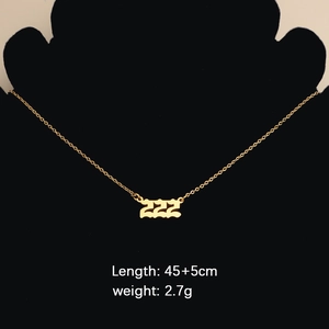 Gold number 222 necklace pendant on black mannequin with length and weight details