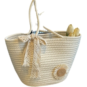 Handmade woven tote bag in cream cotton with lace bow and daisy floral detail