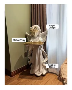 Detail of the golden metal tray and vintage angel statue for home decoration