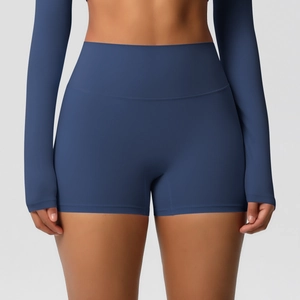 Detailed close-up of dark blue high-waisted yoga shorts with tummy control and lifting effect