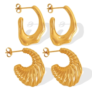 Set of two vintage irregular gold textured hoop earrings with a polished metallic finish