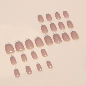 Classic French tip press-on nails in short square shape with glossy nude pink and white finish