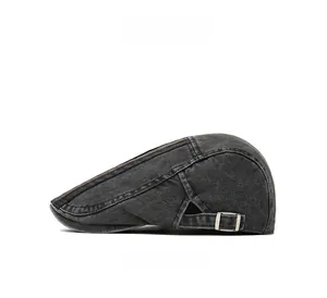 Detailed side view of washed cotton newsboy cap with adjustable metal buckle and racing stripe