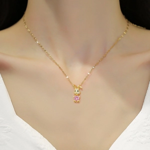 Elegant gold necklace featuring a pink gemstone bunny pendant with sparkling pavé zircons