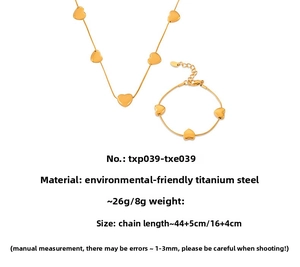 Detailed view of gold heart necklace and bracelet set with dimensions and material specs