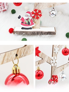 Detail view of mini wooden Christmas tree tabletop decor with Santa and snowflake ornaments