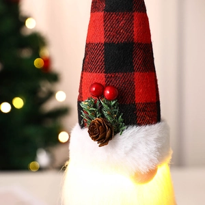 Close-up of glowing Christmas gnome with red plaid hat and pine cone details