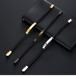 Detail of multi-layer braided leather bracelets with polished metal plates and clasps