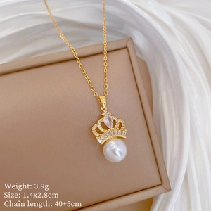 Detailed view of crown pendant with pearl and zircon inlay, measuring 1.4x2.8cm