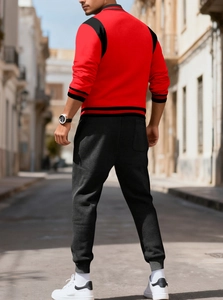 Rear view of men's casual tracksuit featuring a red and black color-block bomber jacket