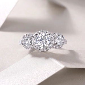 Elegant S925 sterling silver three-stone halo ring featuring round brilliant moissanite