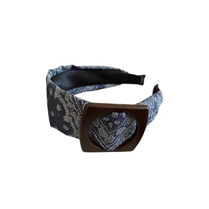 Blue paisley print wide headband with brown buckle detail and high crown vintage style