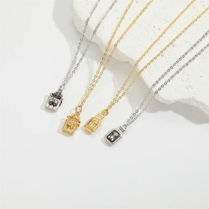 French vintage bear pendant necklaces in gold and silver finish on white stone