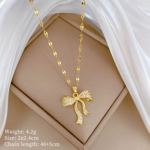 Detail shot of a crystal-encrusted bow necklace with weight and size specifications