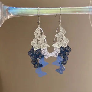 Blue gradient hollow butterfly tassel earrings with silver hooks for a sweet look