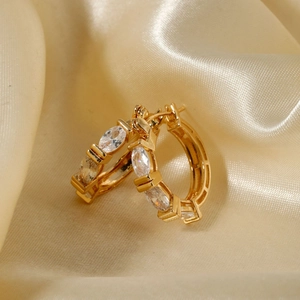 Exquisite gold-plated hoop earrings with marquise-cut zircons on champagne silk