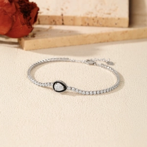 S925 sterling silver tennis bracelet featuring black enamel drop pendant and clear crystals