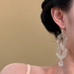 Silver layered concentric circle drop earrings with a sparkling zircon pendant for women