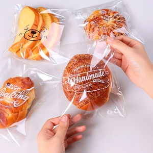 Set of four transparent bread packaging bags with cute bear faces and baking prints